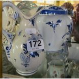 A Delft blue and white jar and cover and a jug