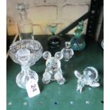 A glass bear, elephant and other glass.