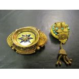 A Victorian gold elliptical brooch and a buckle brooch