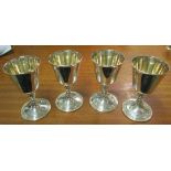 A set of four silver goblets