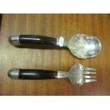 A pair white metal salad servers