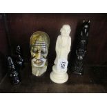 A bust of African gentleman, totem pole, carved figure and two black figures