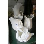 Four vases in shape of swans