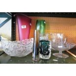 Three green glass vases and other glass.