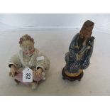 An oriental figure and nodding head figure