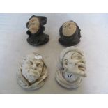 Four pottery wall masks monks heads