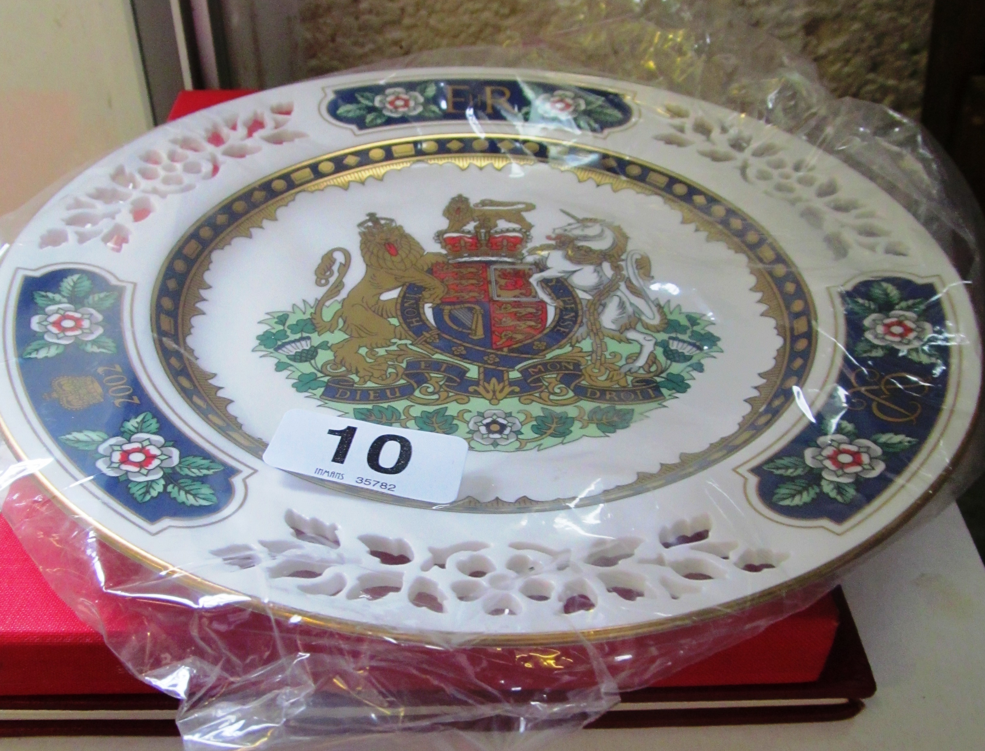 A Spode Queen Elizabeth plate and two commemorative books