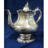 A silver (Sheffield 1864) teapot with seated Oriental gentleman finial on baluster body engraved