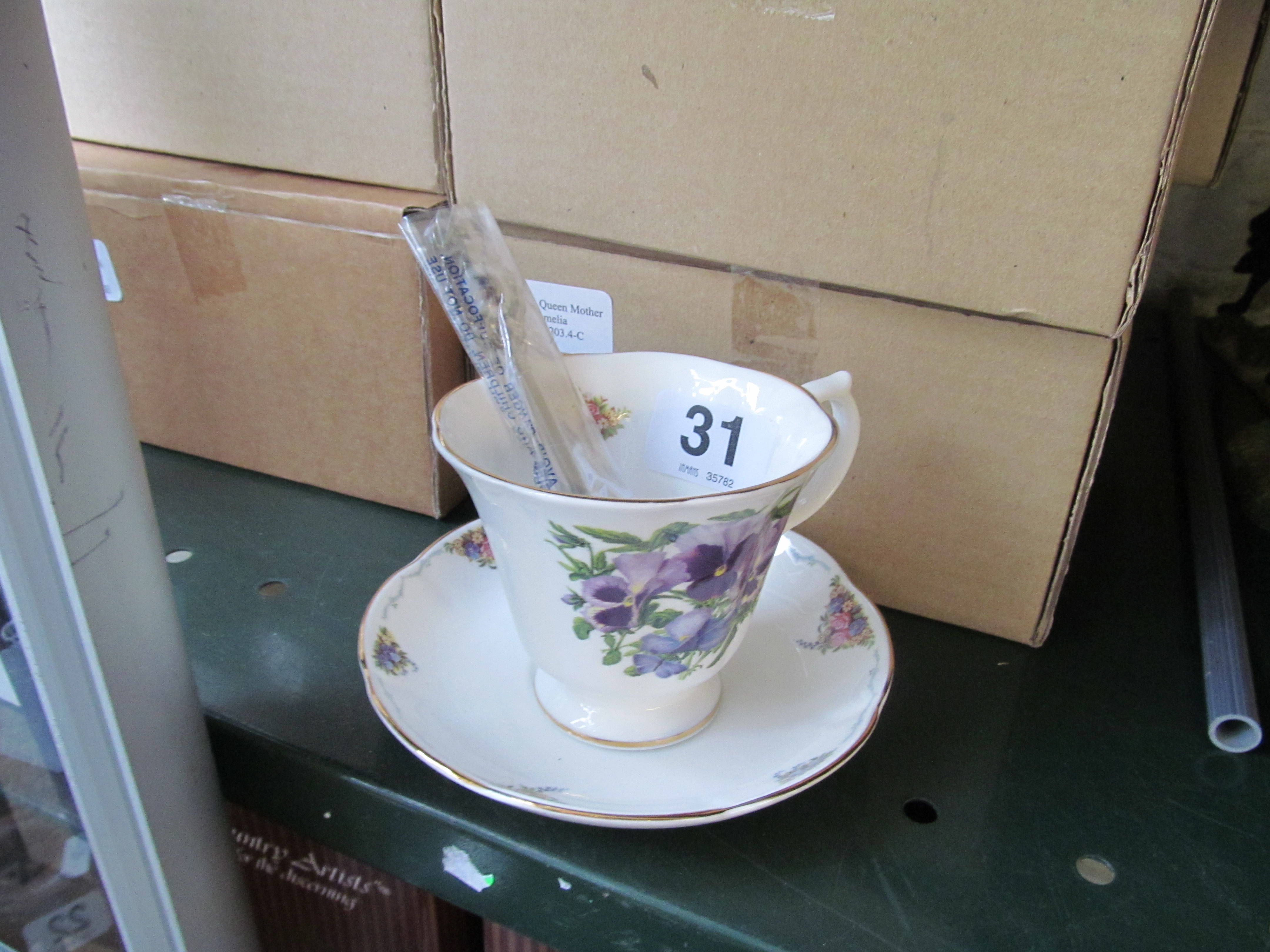 A set of eight Royal Stratford cups, saucers and spoons (boxed) Flowers 'Tea with Queen Mother'