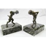 A pair bronze bookends half boy, half goat