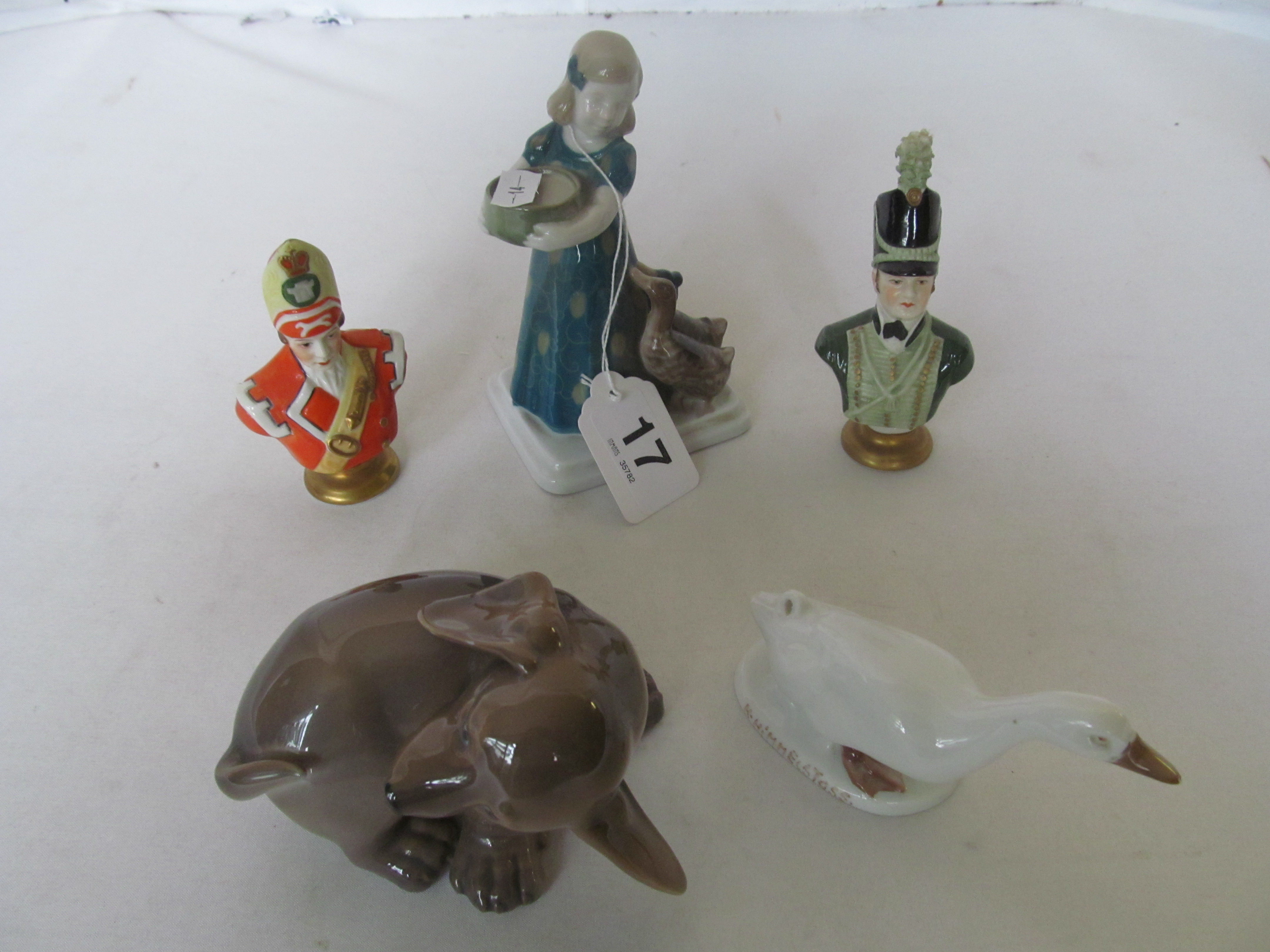 A Royal Copenhagen puppy, two Rosenthal items and a pair of Military figures.