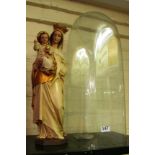 A religious statue Mary and Child under glass dome