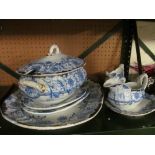 A blue and white tureen and cover, platter, sauceboat on stand, two other platters and sauceboat