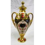 A Royal Crown Derby lidded vase.