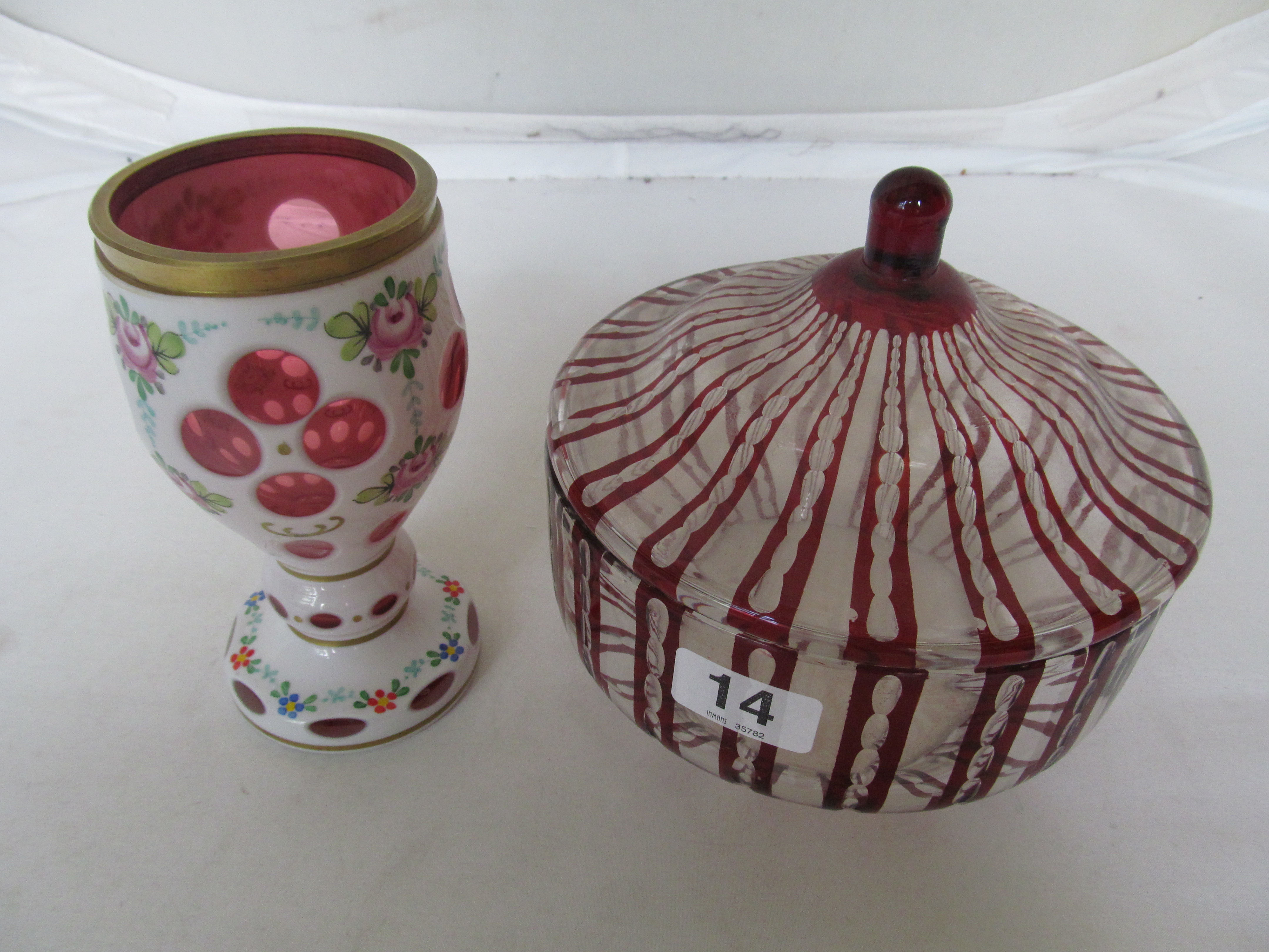 A Ruby flash glass bowl and cover and an overlay vase.