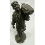 A 19th Century signed Japanese bronze fisherman carrying fish in basket