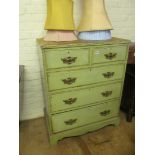 A green painted chest of two short and three long drawers