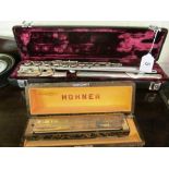 A Buffet flute (i.c) and a Homer harmonica (i.c)