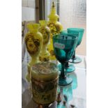 A garniture yellow spattered glass vases and a similar pot with enamelled decoration and three green