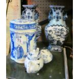 A pair of modern oriental blue and white vases, blue and white caddy and a miniature teapot