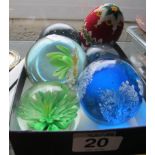 A group of paperweights and a beaded egg