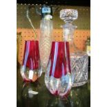 A claret jug with plated neck, decanter and two red glass vases