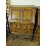 A 1920s oak panelled bureau