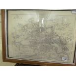 A framed map of Glasgow and two unframed map prints