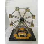 A Meccano Ferris Wheel wired to rotate.