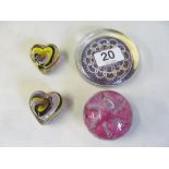 A favrile style lustre glass paperweight and seven other paperweights.