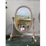 A brass mirror on stand