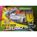 A Club Circuit Scalextric (boxed), another Bash & Crash Scalextric and a bag of extra track