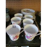 A Dresden set:- eight saucers, six cups and a plate