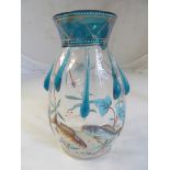 A glass vase decorated fish