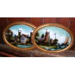 A pair of 48cm x 34cm convex oval inside paintings on glass - lighthouse and manor house scenes