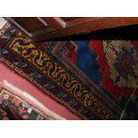 A 200cm x 130cm Sivas rug with red/blue ground