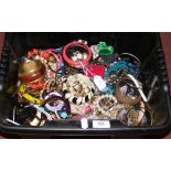 Plastic box containing large selection of costume jewellery including bangles, etc
