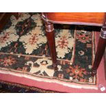 A 210cm x 190cm Turkish woollen rug with beige ground, multi medallion centre panel