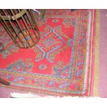 A 205cm x 109cm Turkish rug with red ground