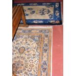 A beige ground Persian rug, together with a similar sized Chinese rug