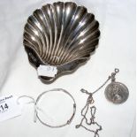 A silver "Scallop" dish with Sheffield hallmark, child's silver bangle and a silver St Christopher