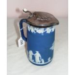 A late Victorian Wedgwood blue jasper ware lidded jug in good condition.