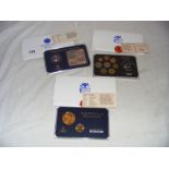 Various cased coin collections.