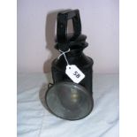 Railway lamp, an mid 20th century signalling tri colour railway lamp, measuring 11.25" tall.