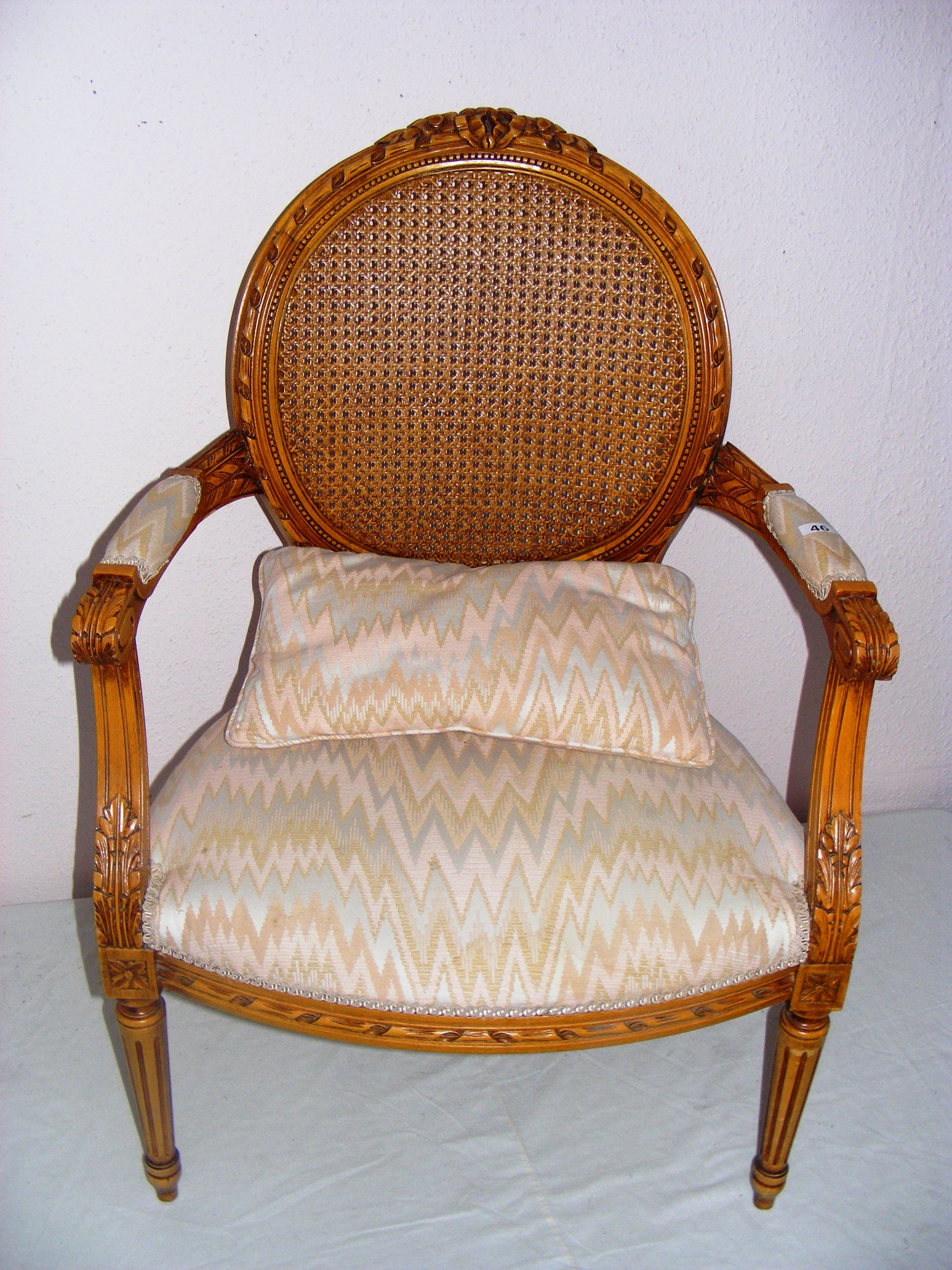 French Louis XIV, a reproduction Bergere arm chair, with a rattan back and lovely carving all round,