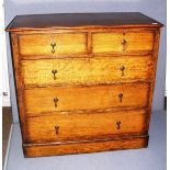 Victorian, a two over three chest of drawers, in solid oak with brass tear drop handles,