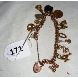 A 9ct gold charm bracelet with various charms and 1914 half 22ct gold sovereign (total weight all
