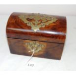 A Victorian rosewood dome shaped tea caddy with brass decoration opening to reveal to lidded