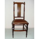 Edwardian, an inlaid hall chair, with an upholstered seat measuring 38.5" tall.