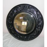 A early 20th century carved circular wall mirror,